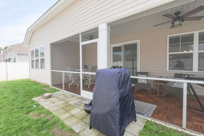 View of patio featuring ceiling fan and fence | Image 27