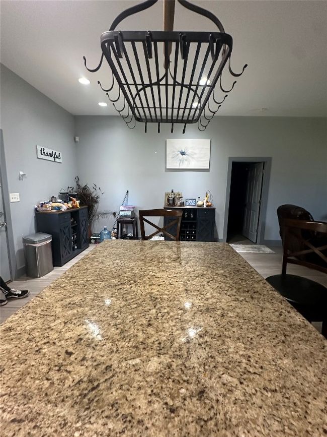 Kitchen with recessed lighting, wood finished floors, and light stone counters | Image 34