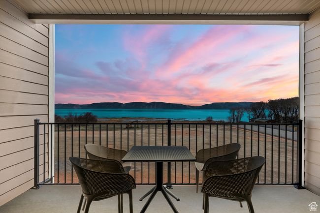 Balcony with a water and mountain view | Image 62