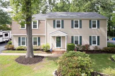 Colonial home featuring a front yard | Image 1