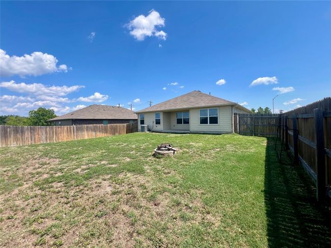 Back of property with a fire pit | Image 29