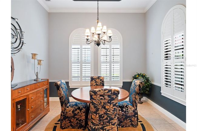 Formal Dining with 12' to 14' tray ceiling with crown molding. | Image 5