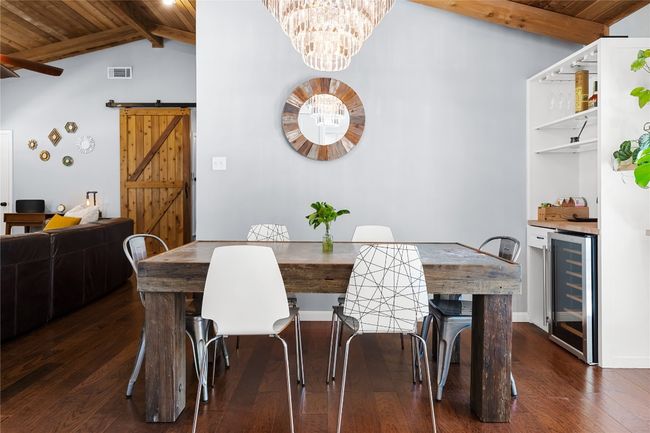 Dining area with stunning chandelier and vaulted ceilings | Image 4