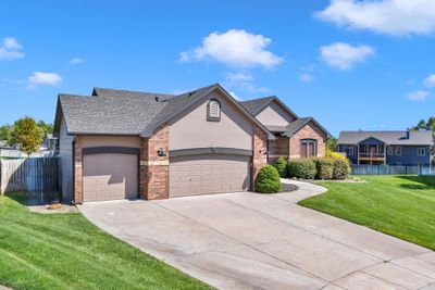 View of front of house featuring a garage and a front yard | Image 2