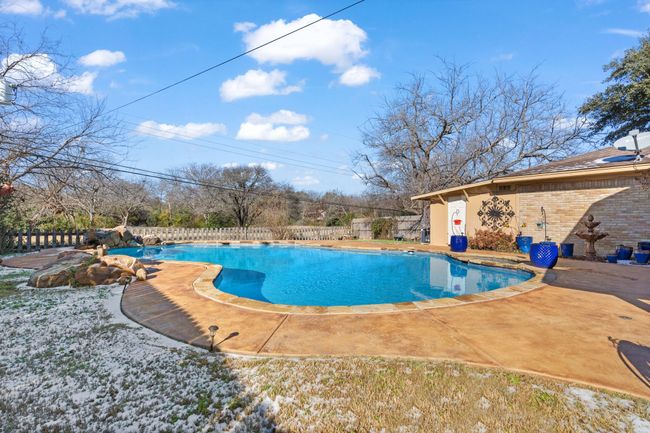 View of swimming pool featuring a patio area | Image 33