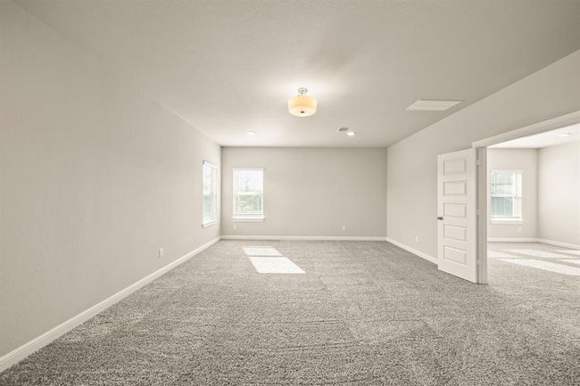 Expansive bonus room ready to be transformed into a media room, home gym, or entertainment zone. | Image 28