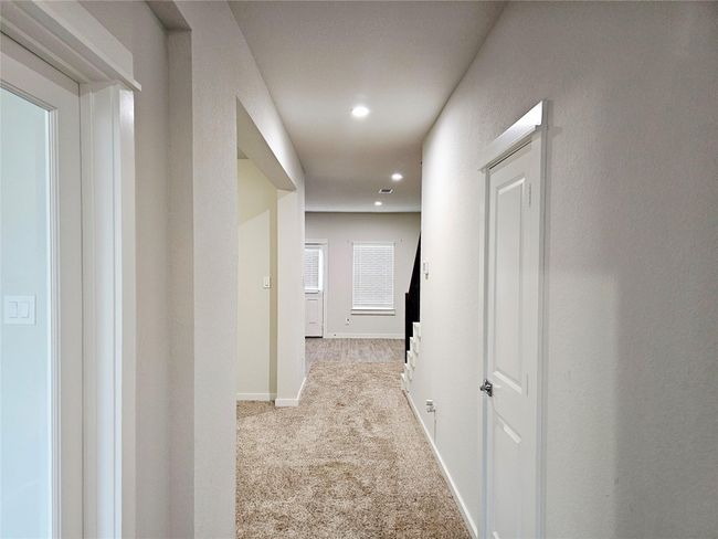View of entrance into this lovely home. Front entry closet and powder room for your guests | Image 4