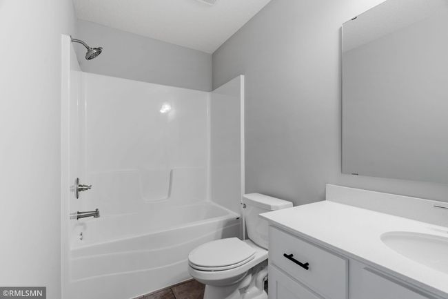(Photo of previously finished home) One of three large bathrooms. | Image 16