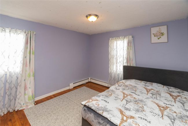 2nd bedroom with hardwood floors | Image 12