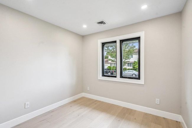 Bedroom featuring light Hardwood flooring and recessed lighting | Image 19