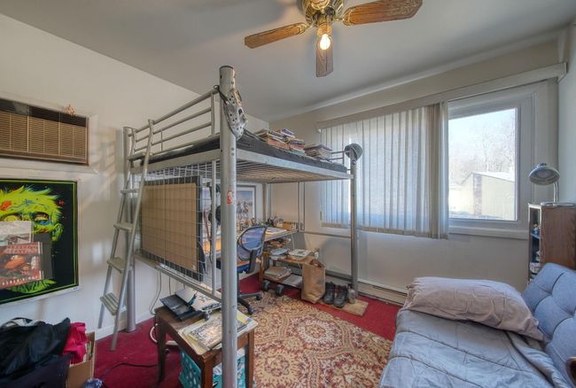 Bedroom with a ceiling fan | Image 15
