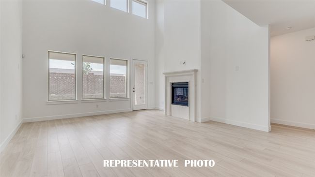You'll find a family room filled with natural light from a wonderful wall of windows in our Provence plan! REPRESENTATIVE PHOTO. | Image 9