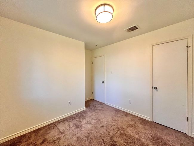 Unfurnished bedroom with carpet flooring and baseboards | Image 15