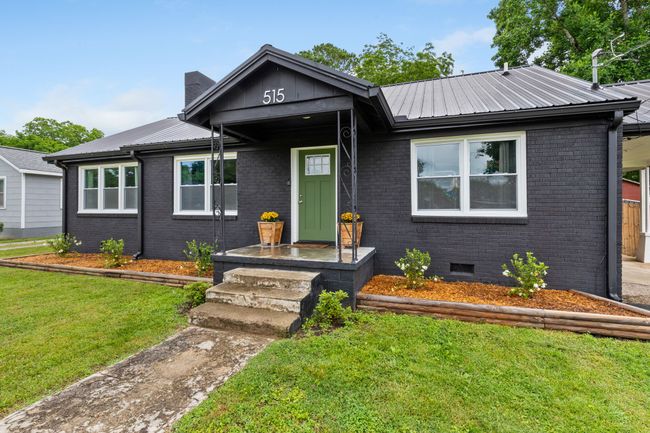 Newer windows are double hung and let in lots of natural light. | Image 4