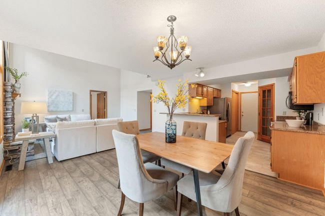 Main level open-concept living room/dining room (with gas fireplace) /kitchen | Image 4