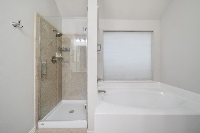 A glass shower and soaking tub give you the option for a quiet soak or hot shower. | Image 19
