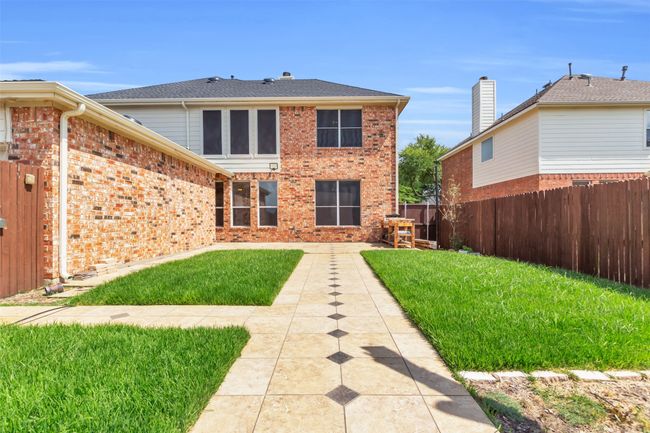 Back of property featuring a fenced backyard. | Image 26