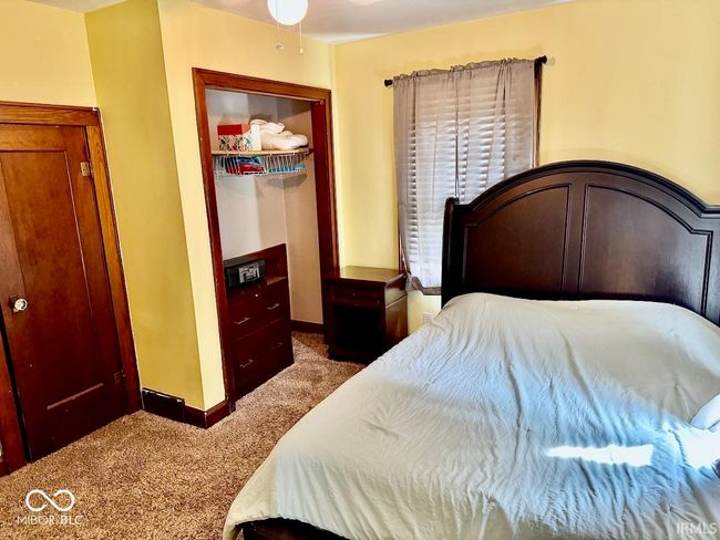 bedroom featuring carpet, a closet, and a spacious closet | Image 26