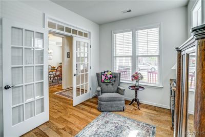 Lovely Office / Study with wood flooring, French doors, and plantation blinds | Image 3