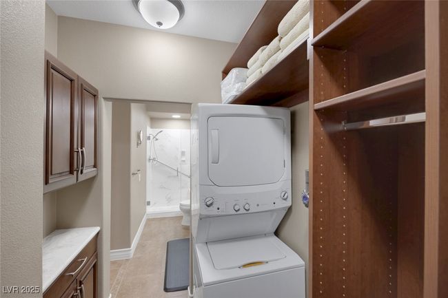 Casita Walk-in closet with Custom Built-ins & GE Washer/Dryer | Image 56