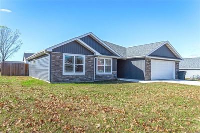 View of front of property featuring a front lawn and a garage | Image 2