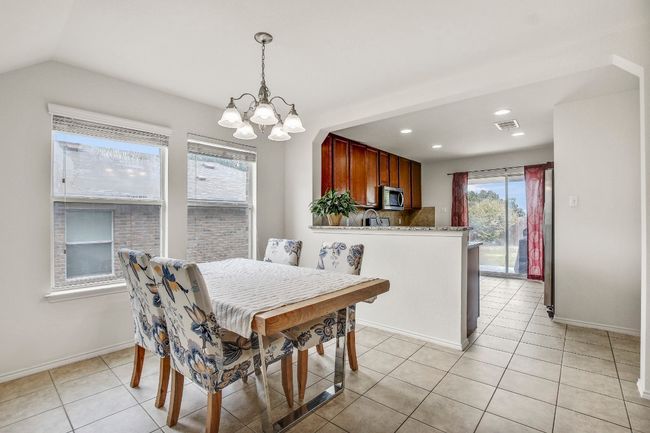 Dining room that looks into kitchen | Image 10