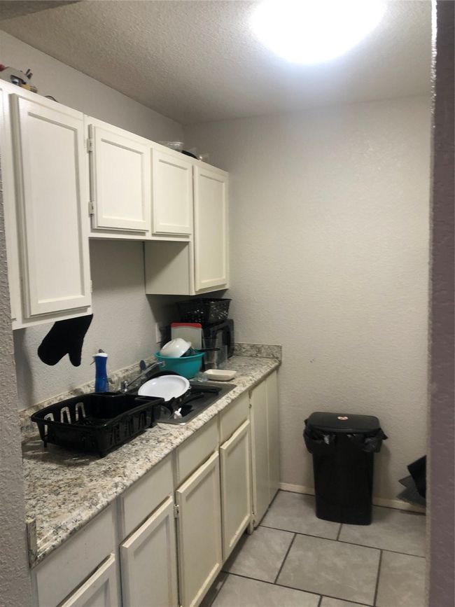 This is a close up of the kitchen. Notice all of the cabinets. | Image 4
