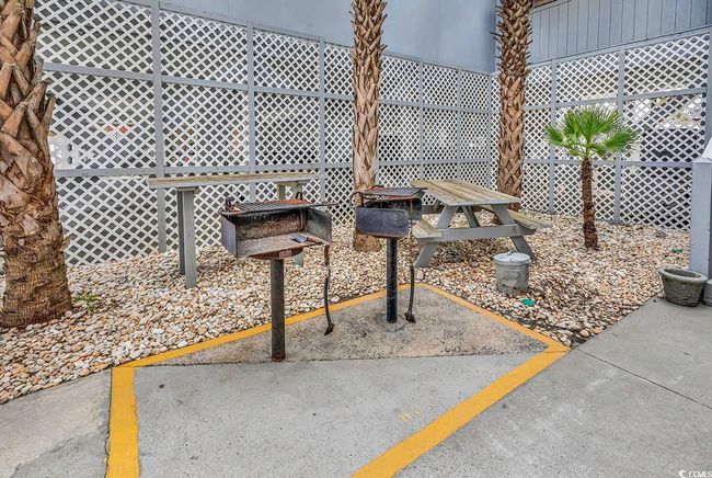 Surrounding community featuring a patio area and fence | Image 33
