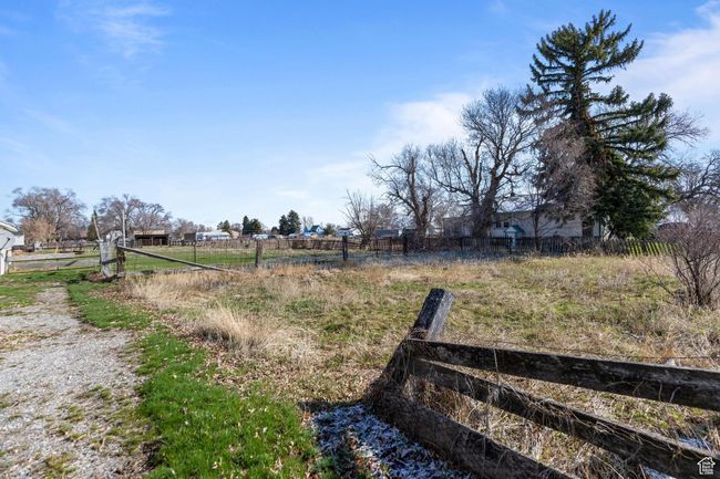 View of yard featuring fence and a rural view | Image 28