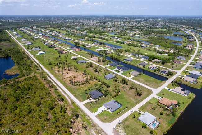 View of property location featuring a nearby body of water and nearby suburban area | Image 5