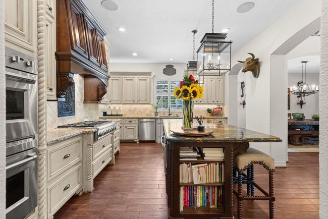 The Chef's kitchen is a true delight! There is a huge 72-inch GE Monogram Built-in Stainless Fridge, 6 Burner GE Monogram gas range, double ovens/convection oven, and huge walk-in pantry. Both dishwashers inside the home were replaced in July 2020... | Image 18