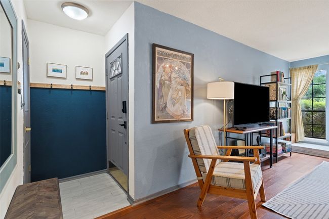 Sitting room with baseboards and wood finished floors | Image 14