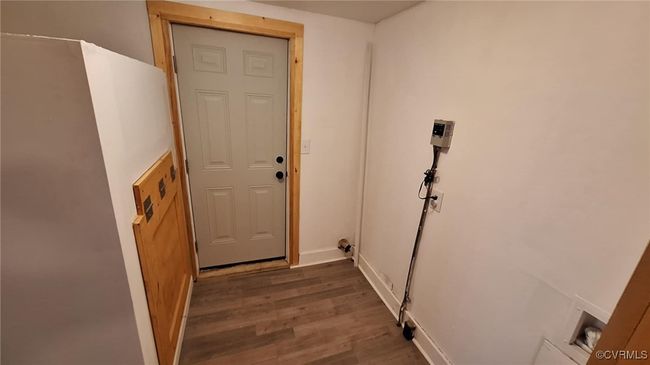 Entryway with baseboards and dark wood finished floors | Image 25