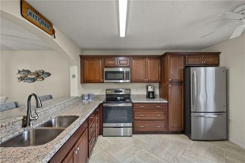 g104-7025 Dennis Cir, NAPLES, FL, 34104-8772 | Card Image