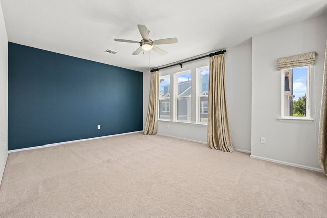 Spare room featuring a ceiling fan and carpet | Image 20