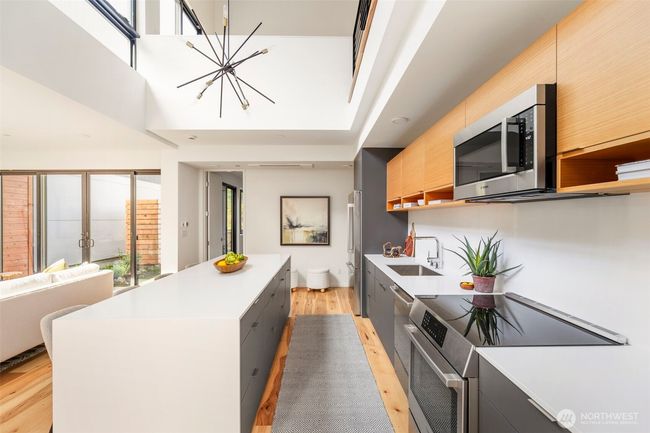 Double-height ceilings create a dramatic and light airy space, perfect for entertaining and relaxation. | Image 8