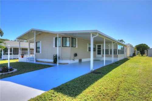 561 Dolphin Cir, Barefoot Bay, FL, 32976-2595 | Card Image