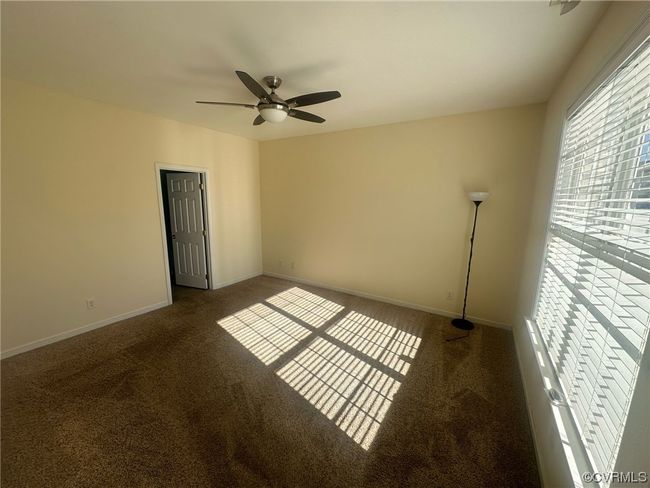 Carpeted empty room with ceiling fan | Image 21