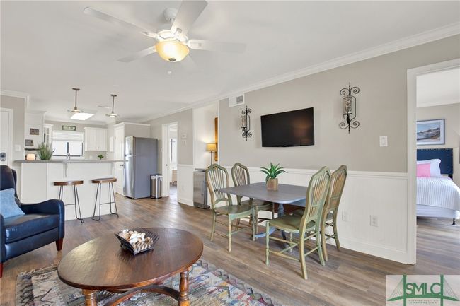 Living Room open to Kitchen & Dining Area with Sliding Glass Door to Spacious Balcony | Image 6