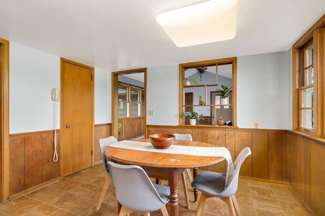 The informal dining room is located just off the kitchen. | Image 12