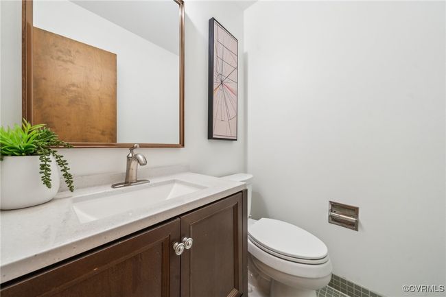 Bathroom featuring vanity and toilet | Image 14