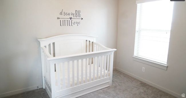 Unfurnished bedroom featuring carpet and a nursery area | Image 5