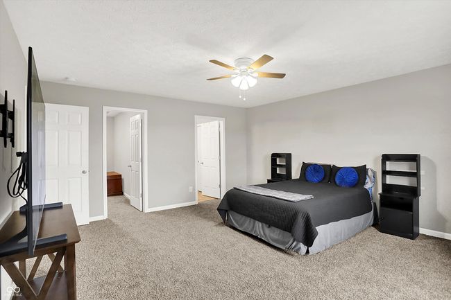 Primary bedroom with brand new carpet has plenty of room for a king-sized bed, desk, multiple dressers, etc. | Image 22