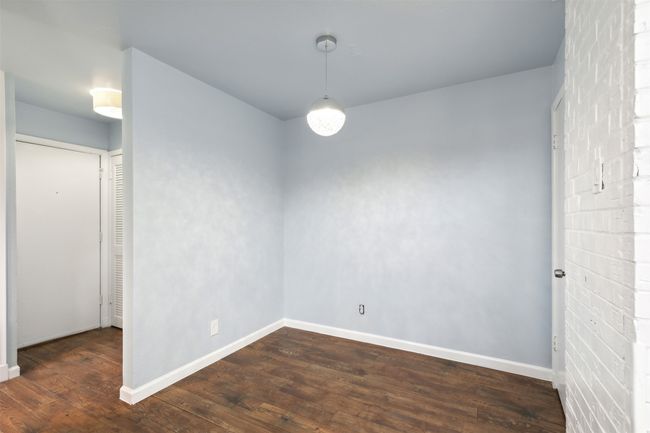 dining room featuring baseboards and wood finished floors | Image 8