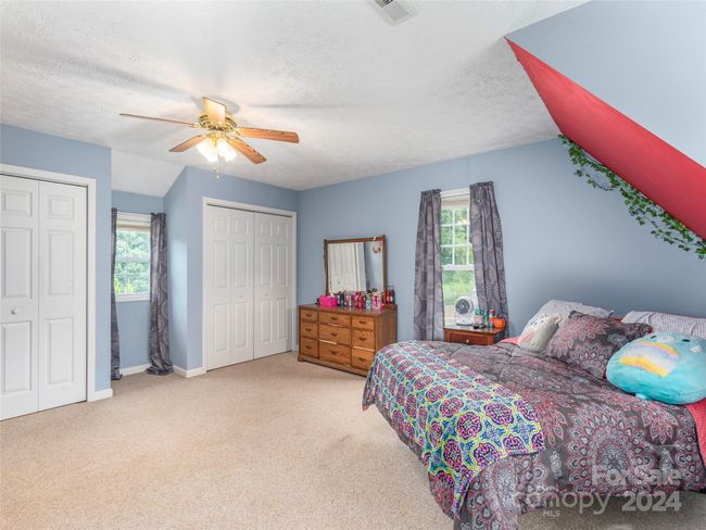 Large guest BR on upper level with 2 closets. | Image 12