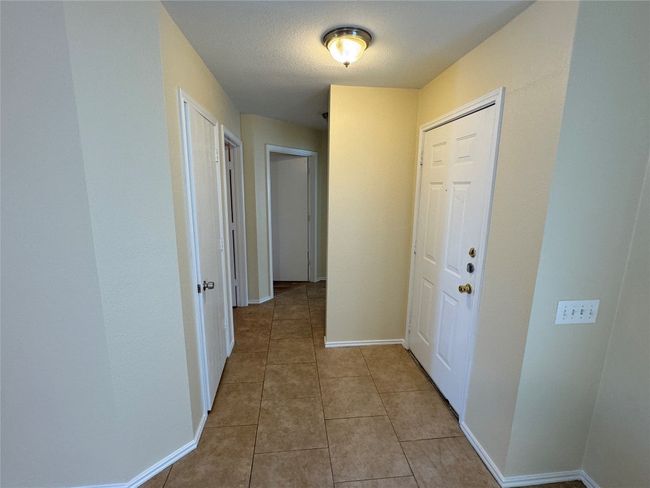 Entry with access to front to bedrooms and second bathroom. | Image 4