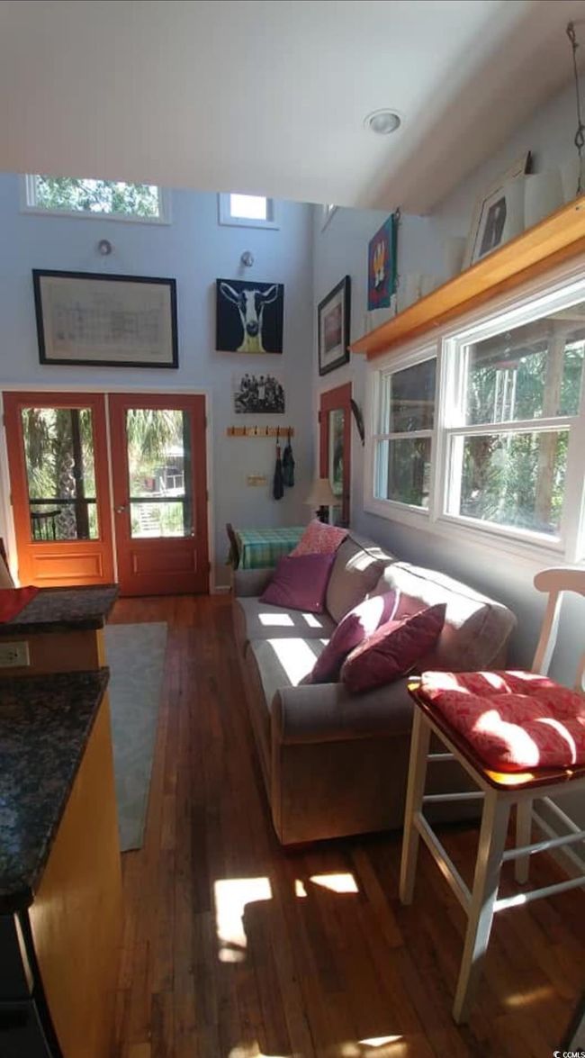 Living room with hardwood / wood-style floors | Image 12