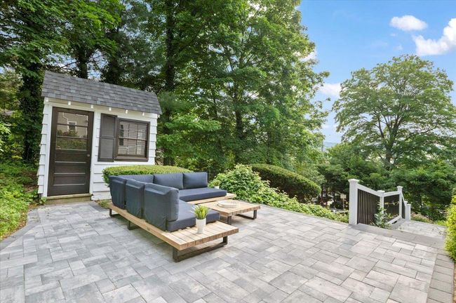 View of patio featuring outdoor lounge area and an outdoor structure | Image 31