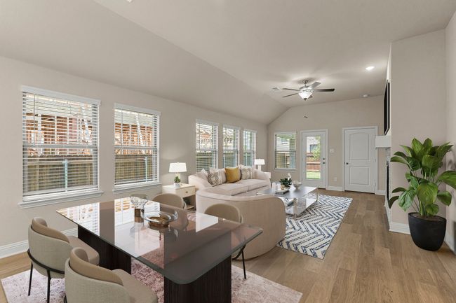 Living room featuring light wood-type flooring, a ceiling fan, and lofted ceiling | Image 13