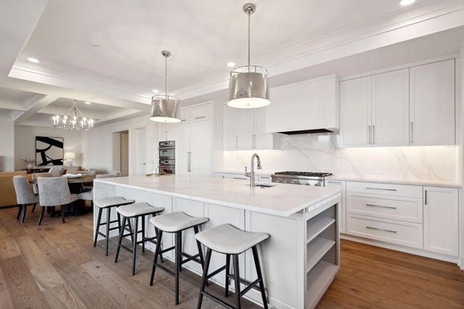 Spacious center island is ideal for meal prep or grabbing a quick bite to eat | Image 10